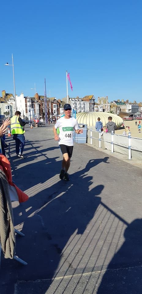 Mark striding in