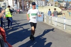 Mark striding in